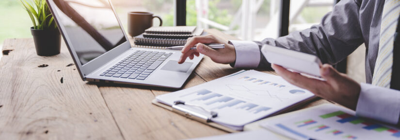 Portrait of a businessman working on a tablet computer in a modern office. Make an account analysis report. real estate investment information financial and tax system concepts